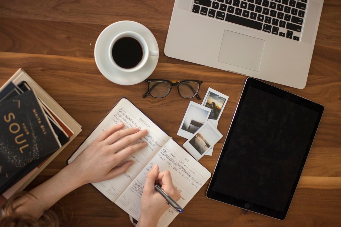 Notebook and laptop workspace while reviewing a converted document